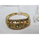 An 18ct gold peridot and rose diamond five stone ring 3.56gm