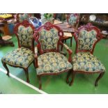 A set of six French style ornate dining chairs upholstered in green and gold