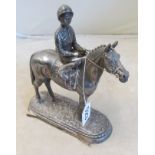 A filled silver model horse and jockey