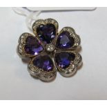 A pretty Edwardian diamond and amethyst flower brooch/pendant