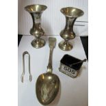 A Victorian silver spoon, pair of silver sugar tongs, pair of silver spill vases, a silver salt