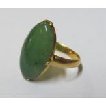 An oval jade ring
