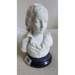 A Parian style bust of a young boy and blue base