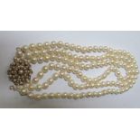 A pearl triple choker necklace with large 9ct gold pearl cluster clasp