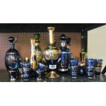 Various Italian blue and green glass decanters and tots