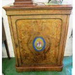 A pair of Victorian walnut pier cabinets, inlaid satinwood decoration and inset oval porcelain