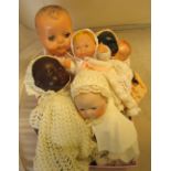 A Pomsons vintage baby doll and five other baby dolls