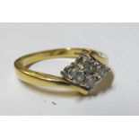 An 18ct gold ring set four diamonds