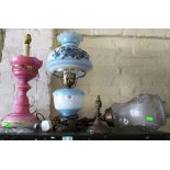 An oil style lamp with blue floral shade and body (electric), a pink glass lustre converted to