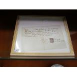 A hand written receipt dated 1895 with postage stamp framed