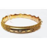 A 9ct gold bracelet with filigree design set three diamonds (10.9gm)