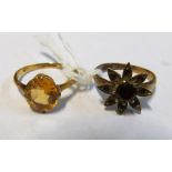 An 18ct gold ring set yellow stone 2.3gm and a 9ct garnet flowerhead ring 2.8gm