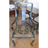 An 1920s ebonized chair with oriental figure to back splat