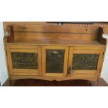 An Edwardian wall cabinet with brass panels of Shakespeare, Anne Hathaway's cottage and