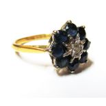 An 18ct gold sapphire and diamond illusion cluster ring