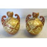A pair of Royal Crown Derby two handled vases red and gilt design on cream ground (some gilt