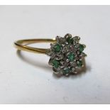A 9ct gold diamond and green stone cluster ring