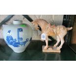 A Chinese pottery horse (a/f) and a blue and white chinese vase