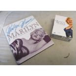 A Marilyn Munroe book 25th Anniversary Edition and a box set of DVD's