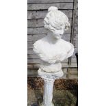 A white bust of a Victorian lady on Corinthian column