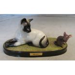 A Beswick group 'Watch It' siamese cat watching a mouse