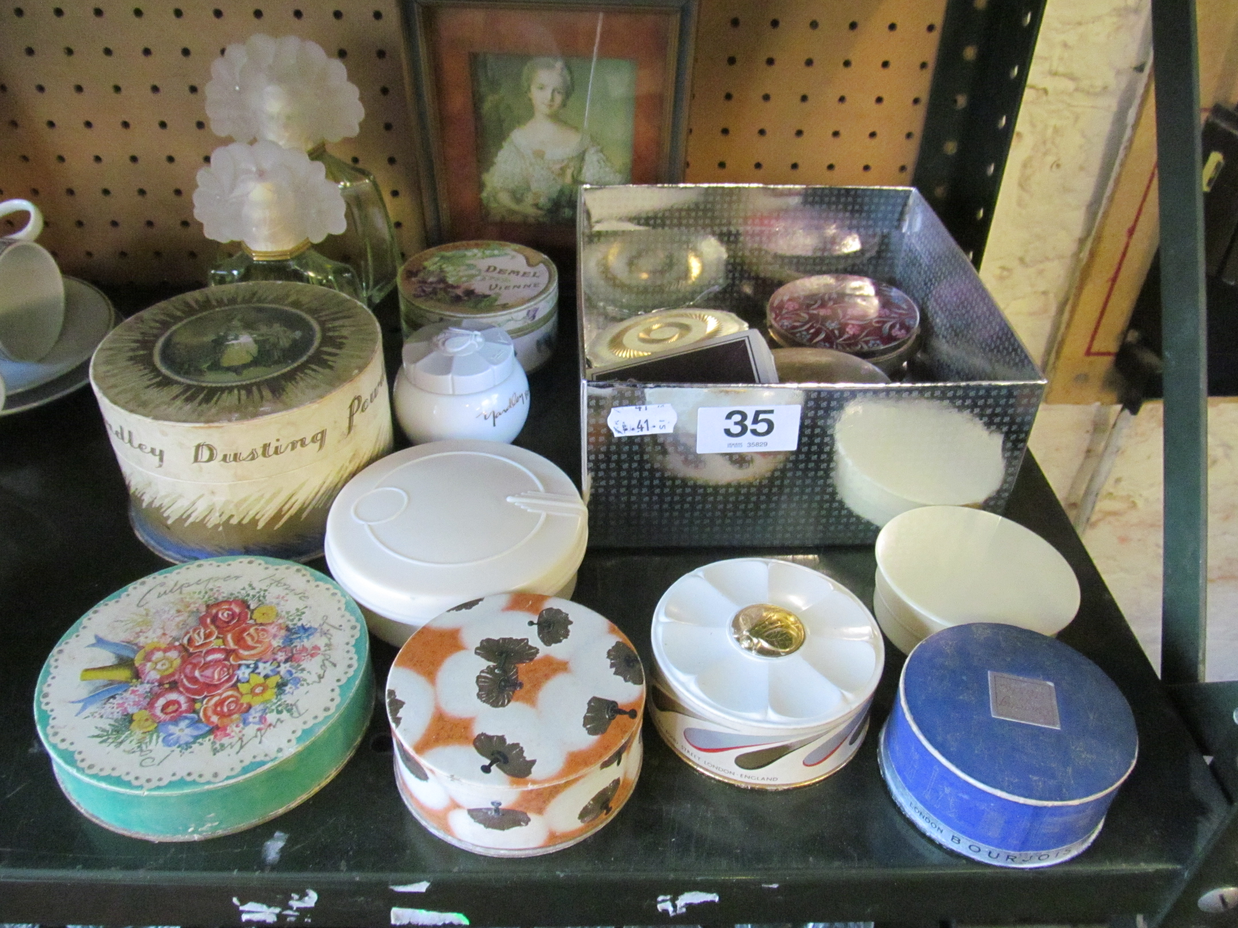 Various compacts, powder boxes, two perfume bottles and a print lady