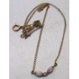 A delicate opal and diamond necklace on 9ct gold chain