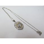A pendant set diamonds on chain marked 750