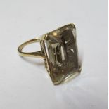 A 9ct gold ring set large yellow stone