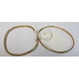 A 9ct gold engraved bangle 3.3gm and another marked 9kt