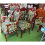 A set of six French style ornate dining chairs upholstered in green and gold