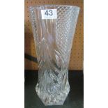 A tall glass vase