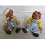 A pair of Raggedy Ann and Raggedy Andy pottery figures signed one signed Ann Humphries