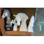 A selection of horsehead ornaments etc