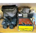 A pair of Bushell binoculars, pair of Magni-Vu binoculars (boxed) and a Panasonic digital camera