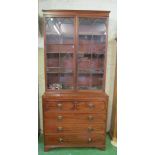 A 19th Century mahogany secretaire bookcase astragal glazed doors above, secretaire drawer and three