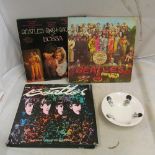 Two Beatles records 'Sgt Peppers Lonley Hearts Club Band', 'The Beatles The Historis Sessions