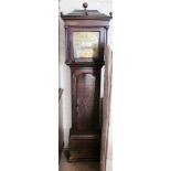 A late 18th Century oak Longcase clock the square hood with ball finials, brass face with floral