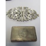 A silver coloured snuff box and silver nurses buckle