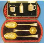 A cased silver set two berry spoons, sifter spoon and condiment set