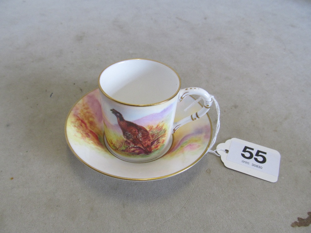 A Royal Worcester cup and saucer pheasant design