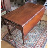 A 19th Century pembroke table on with drawer on tapered ring turned supports and four semi-balloon