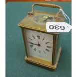 A brass cased carriage clock