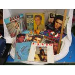 Twelve vintage Elvis Presley albums and a single, modern boxed CD collection and two DVD's