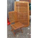 A teak garden table and four chairs