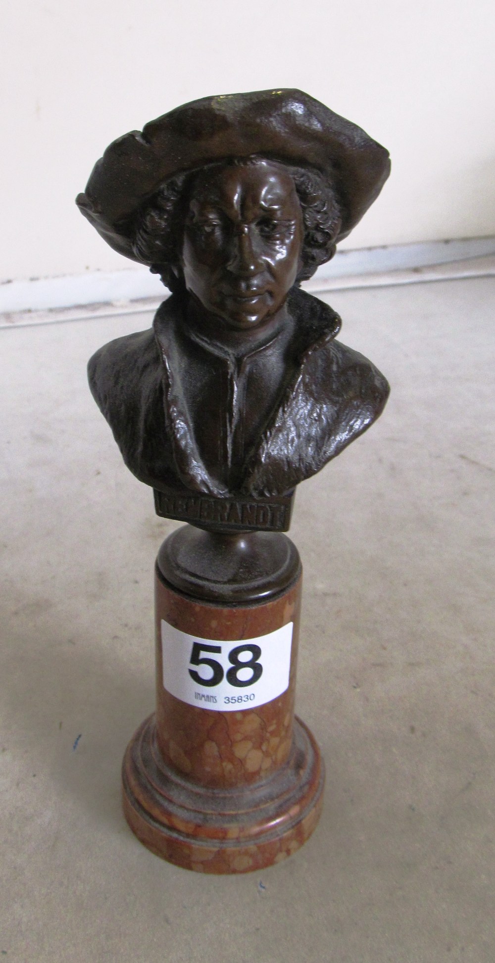 A bronze small bust of Rembrandt on pillar