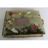 A Victorian velvet covered album of pressed flowers