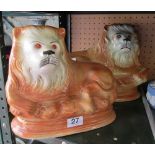 A pair of pottery lion ornaments (one ear restored)