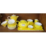 A Tete a Tete yellow teaset, ashtray and another set