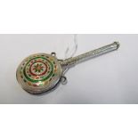 A white metal and enamel rattle